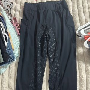 Black horseback riding pants in the size medium.